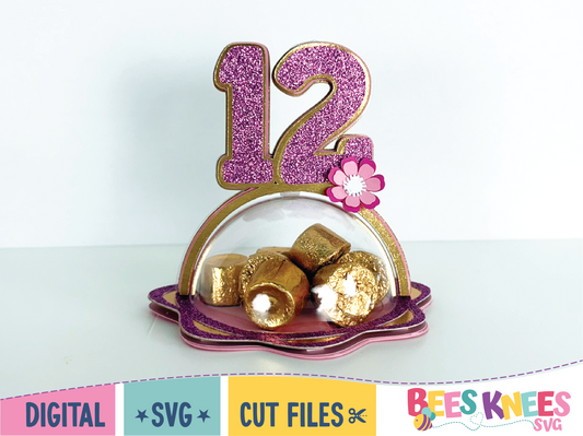 Decorative number '12' candy holder with gold elements on a white background, 