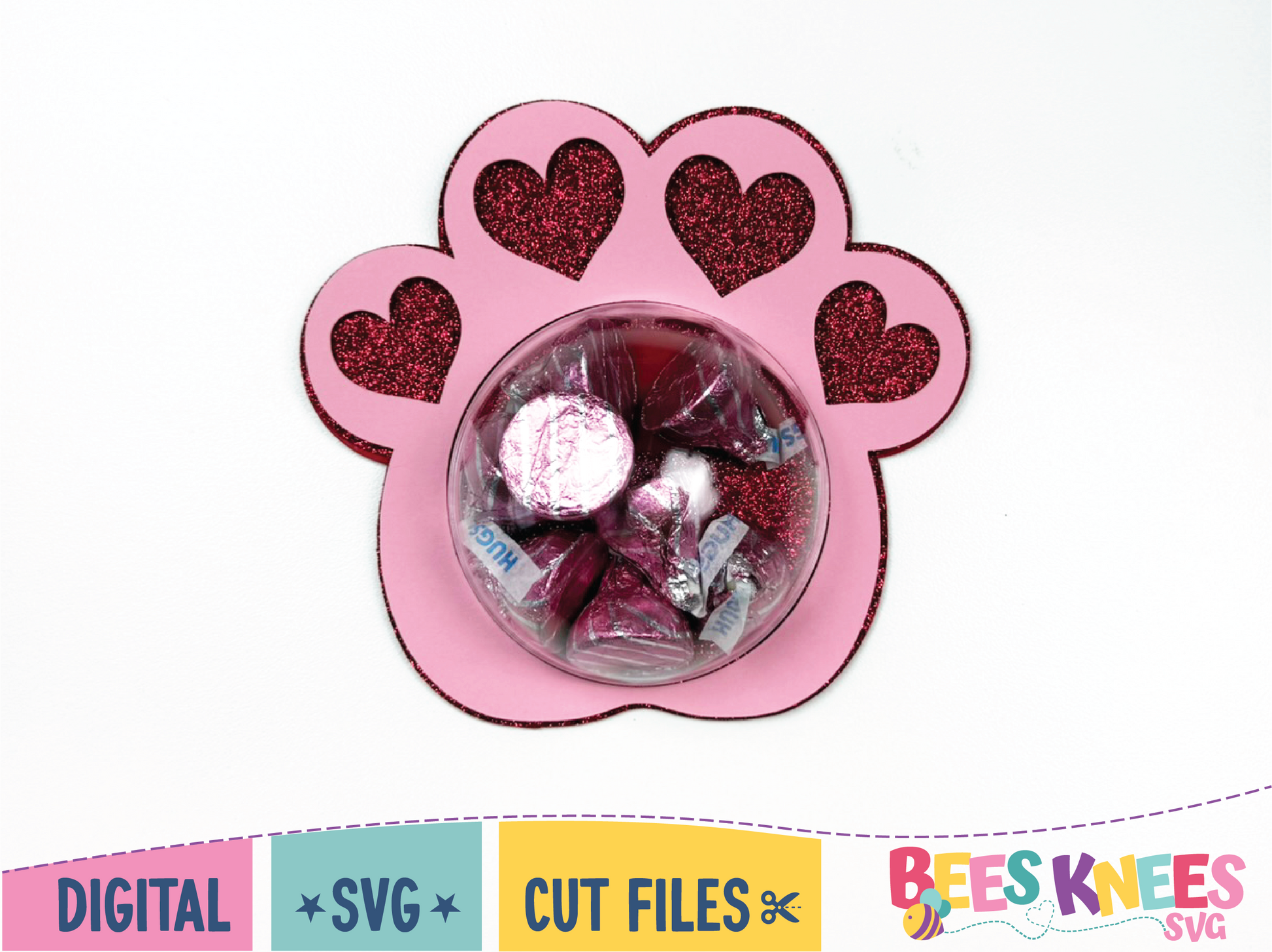 Pink paw-shaped container with heart designs filled with small items on a white background, featuring 'Bees Knees SVG' branding.